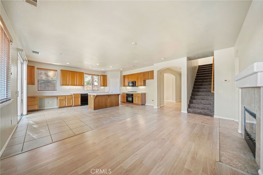 3175 Sand Pine Trail Hemet, CA 92545 - Photo 7 of 31 a view of an empty room with wooden floor and a window