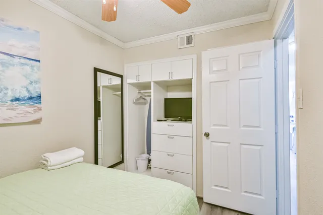 a bedroom with a bed and a view of bathroom