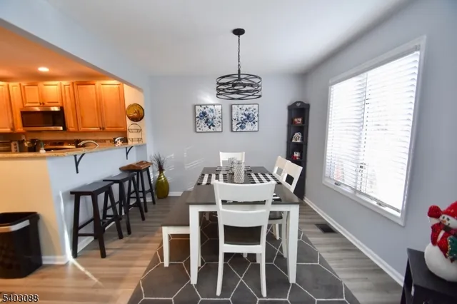 a dining room with furniture window wooden floor