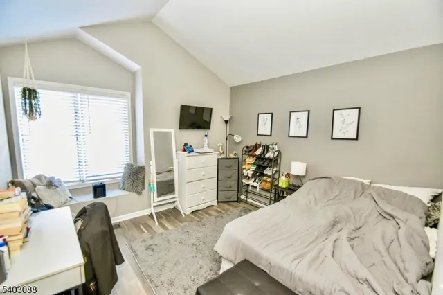 a bed room with a bed and a chair