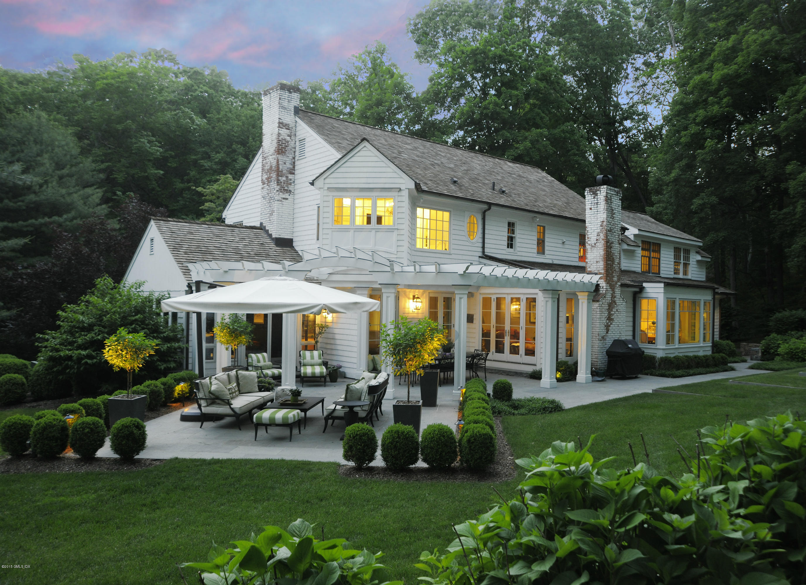a aerial view of a house with garden and trees