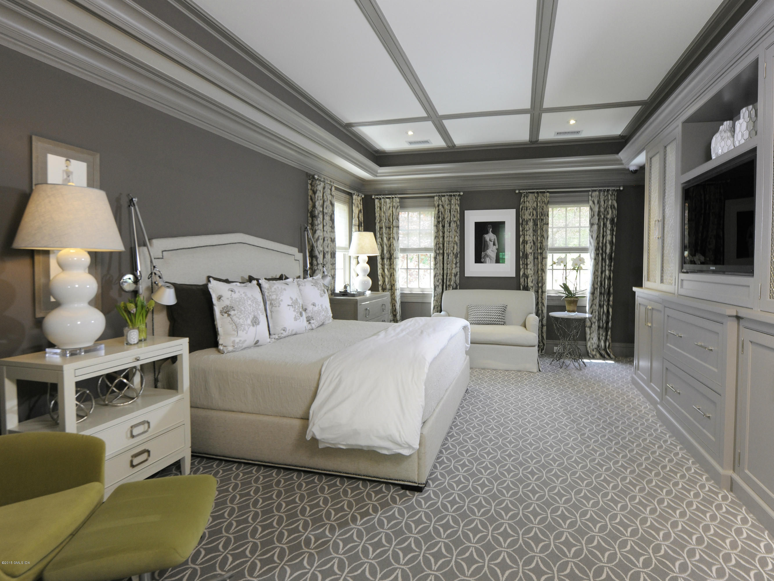 29 Butternut Hollow Road Greenwich, CT 06830 - Photo 13 of 29 a spacious bedroom with a bed a flat screen tv and dresser next to a window