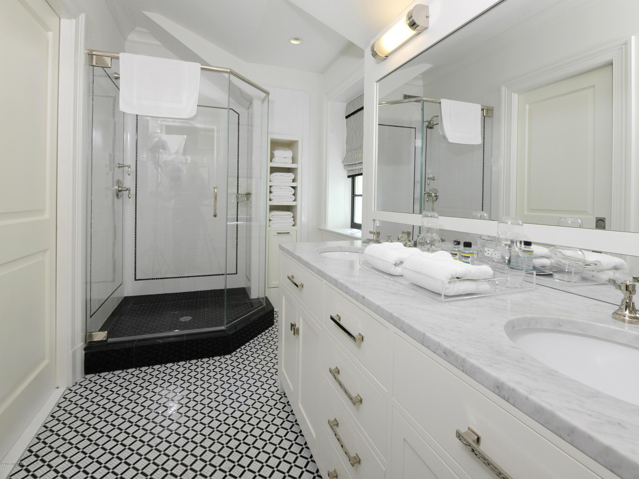 29 Butternut Hollow Road Greenwich, CT 06830 - Photo 17 of 29 a bathroom with a sink and a mirror