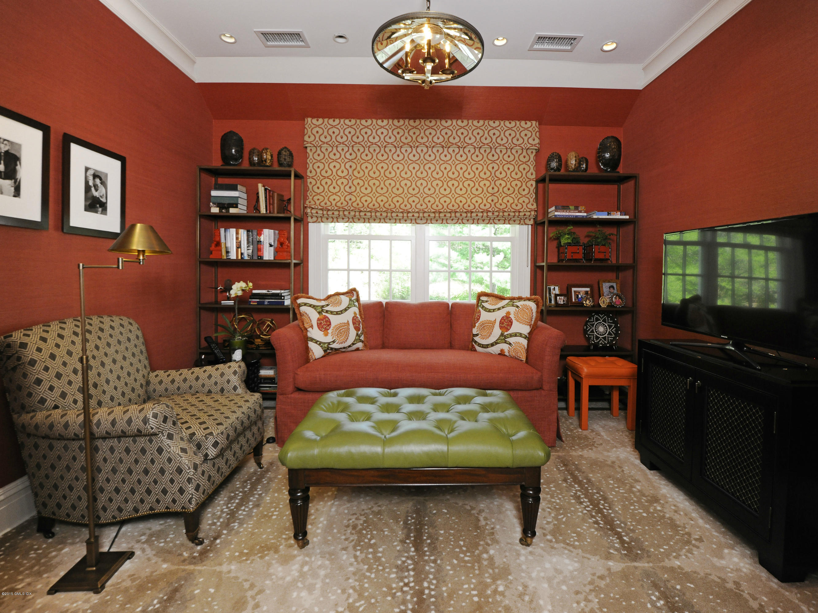 29 Butternut Hollow Road Greenwich, CT 06830 - Photo 19 of 29 a living room with furniture a rug and a bookshelf
