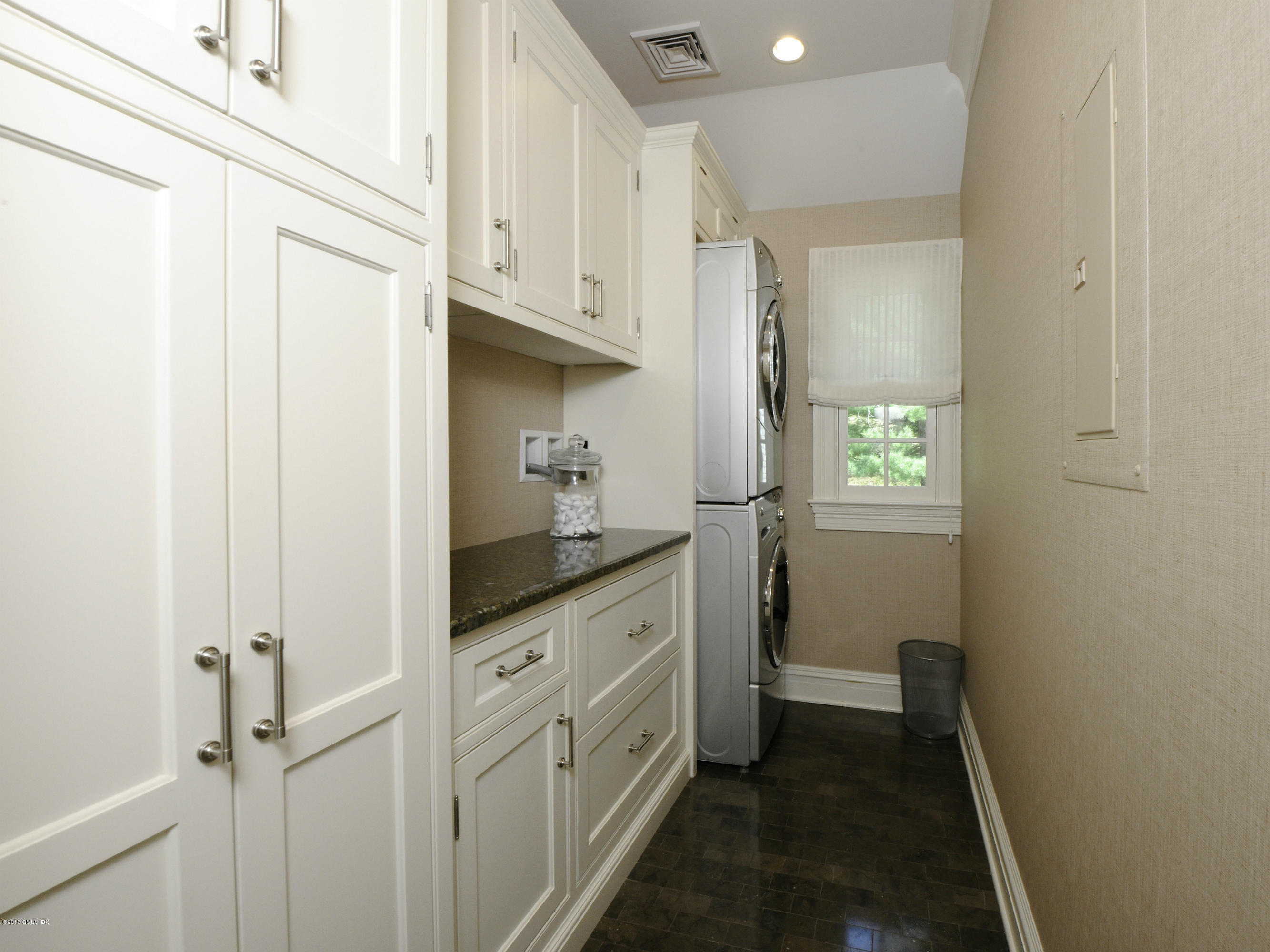 29 Butternut Hollow Road Greenwich, CT 06830 - Photo 21 of 29 a bathroom with a granite countertop sink and a window