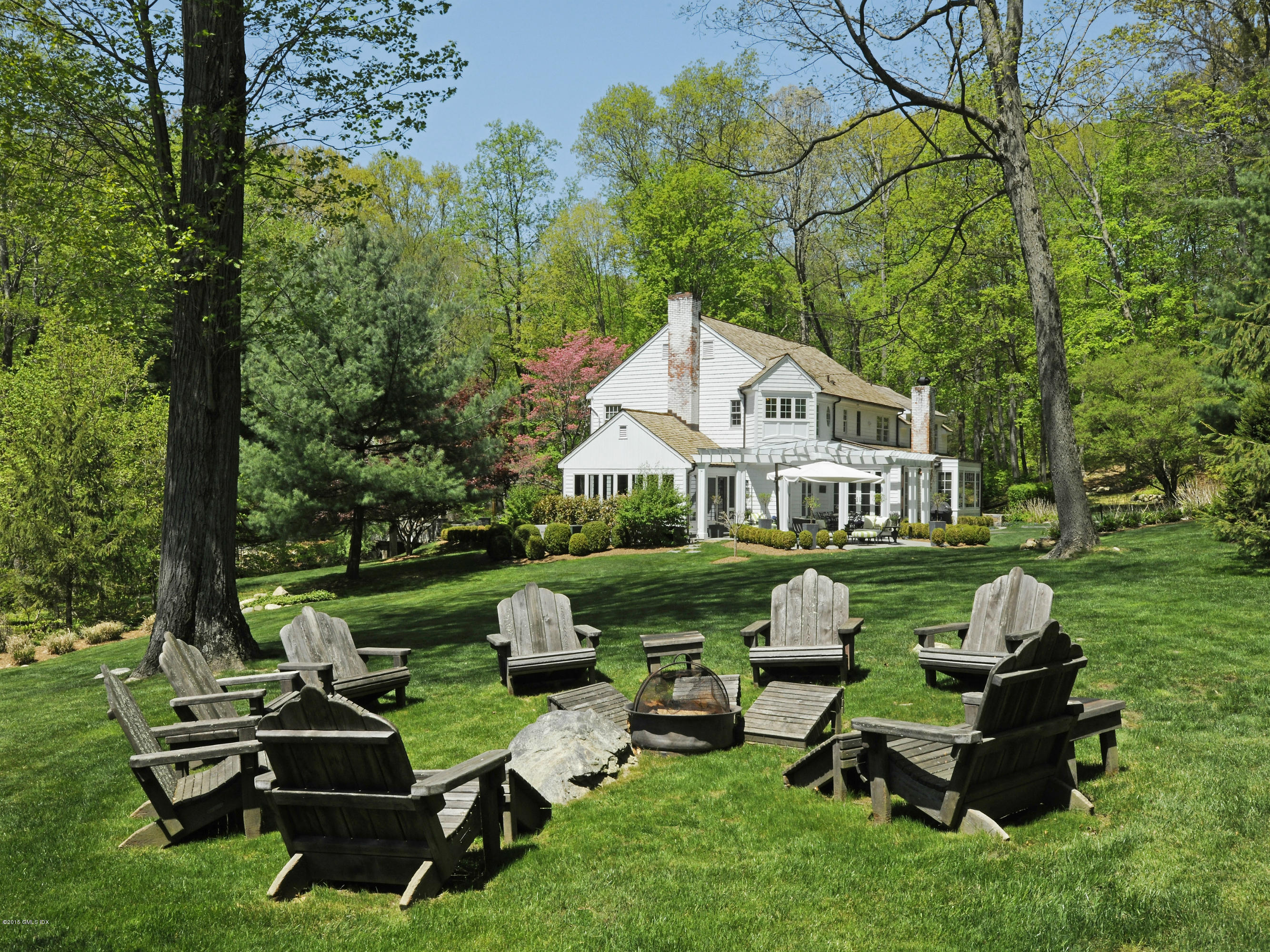 29 Butternut Hollow Road Greenwich, CT 06830 - Photo 25 of 29 a front view of a house with garden and sitting area