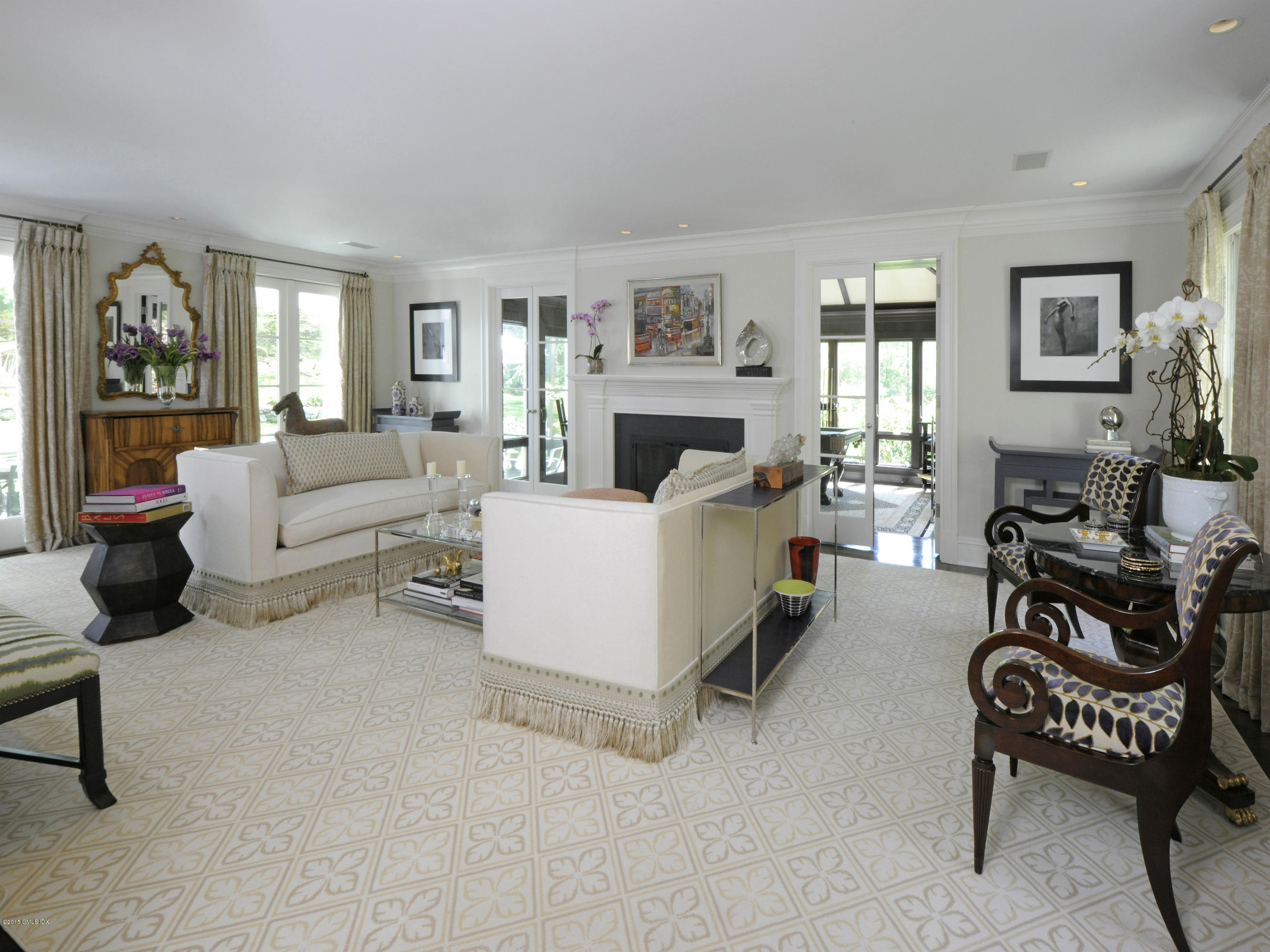 29 Butternut Hollow Road Greenwich, CT 06830 - Photo 5 of 29 a living room with furniture and a chandelier