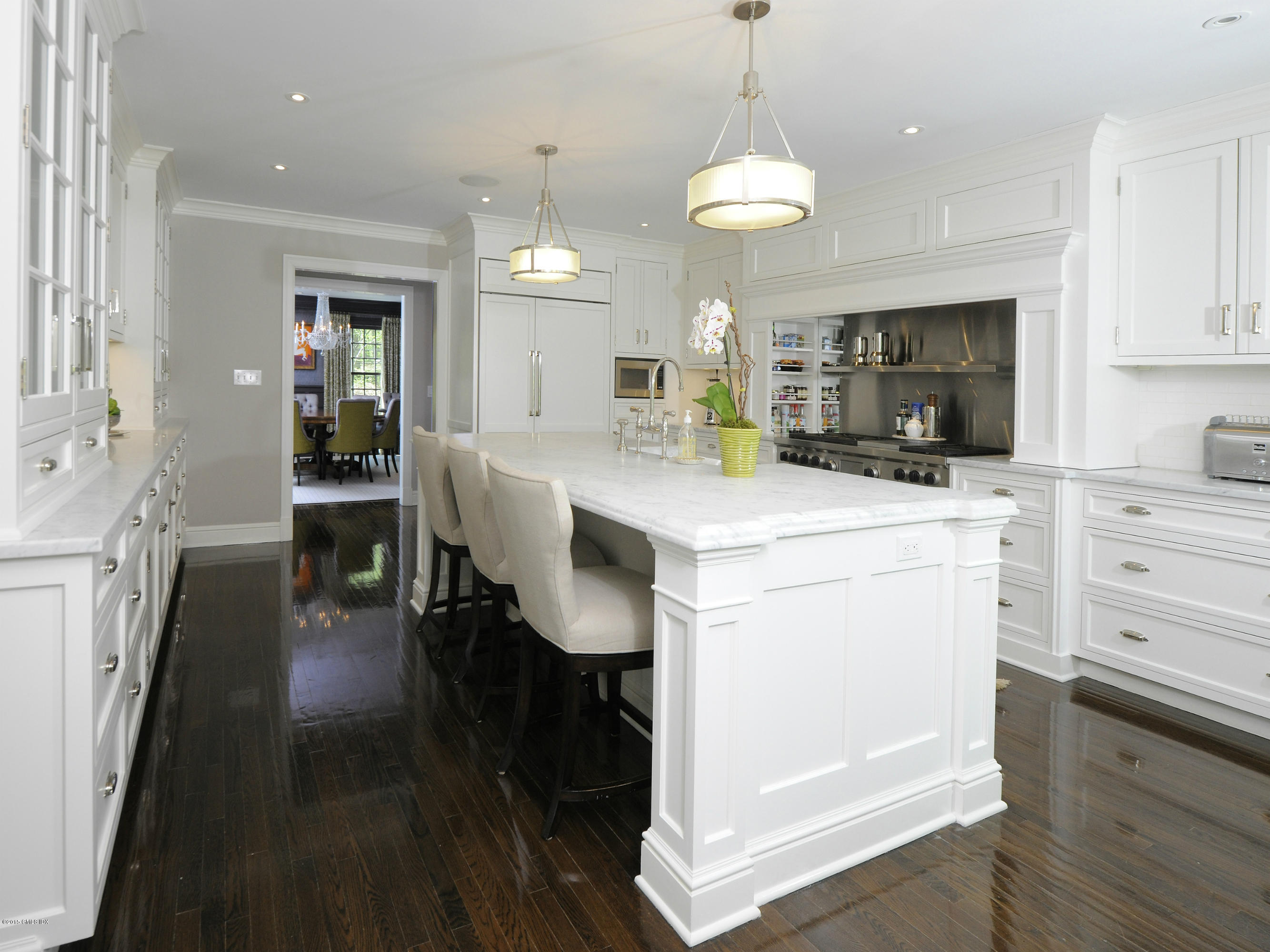 29 Butternut Hollow Road Greenwich, CT 06830 - Photo 7 of 29 a kitchen that has a lot of cabinets in it and wooden floors