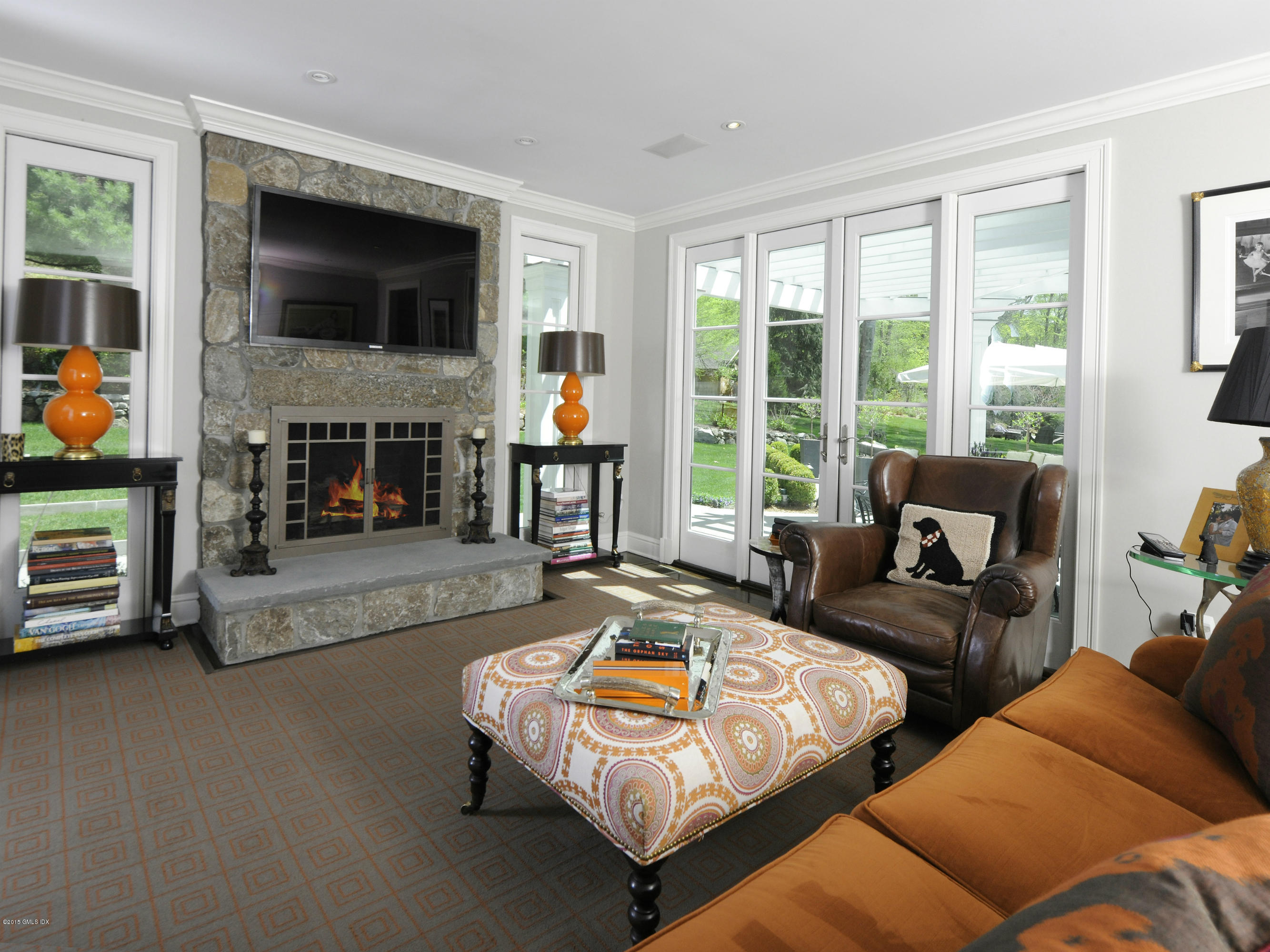 29 Butternut Hollow Road Greenwich, CT 06830 - Photo 10 of 29 a living room with furniture fireplace and flat screen tv
