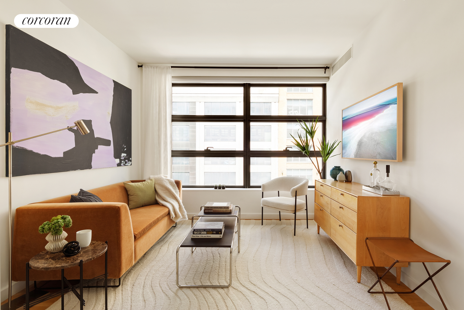 a living room with furniture and a flat screen tv