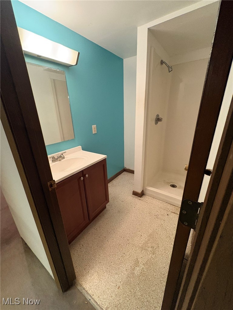 840 Walter Road Medina, OH 44256 - Photo 19 of 21 Full bath with vanity, a stall shower, and light flooring