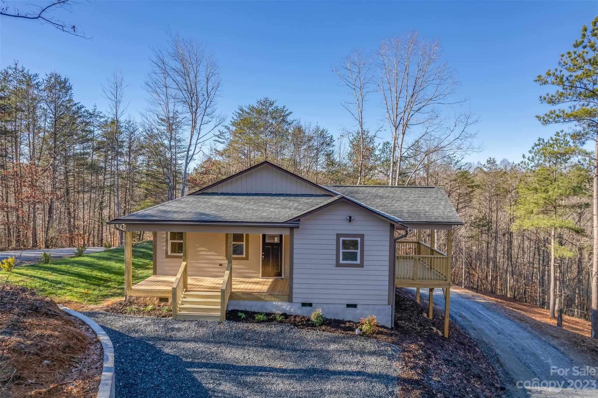 306 Observation Ridge Rutherfordton, NC 28139 - Photo 1 of 36 a front view of a house with garden