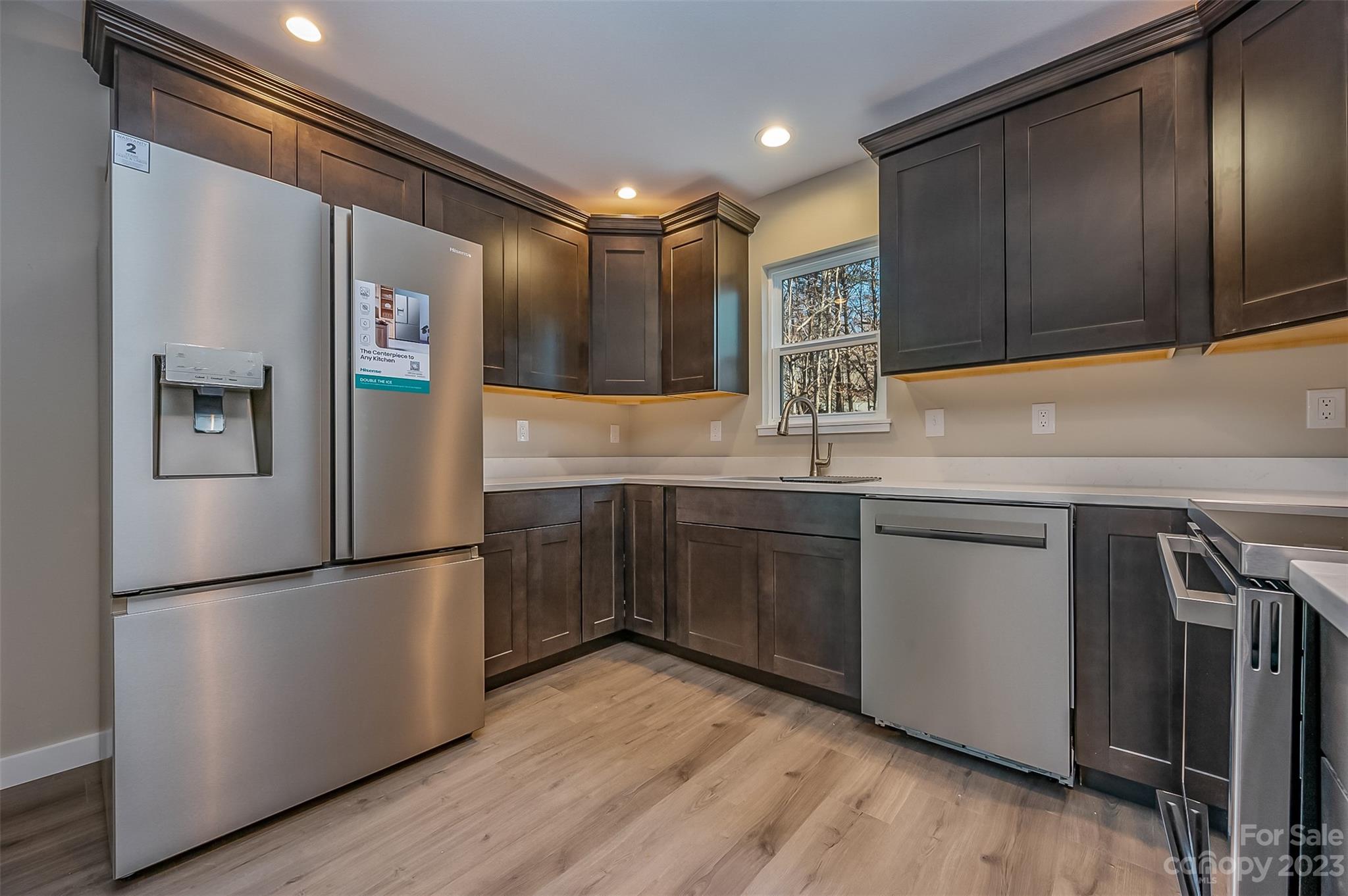 306 Observation Ridge Rutherfordton, NC 28139 - Photo 11 of 36 a kitchen with stainless steel appliances granite countertop a refrigerator and a sink