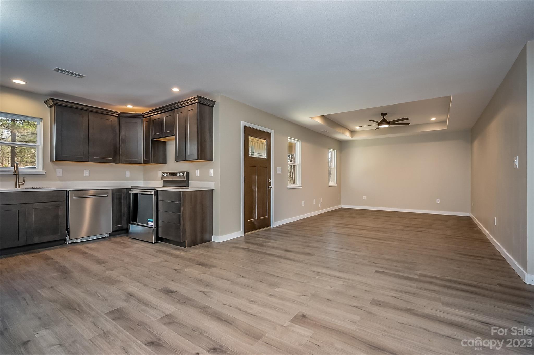 306 Observation Ridge Rutherfordton, NC 28139 - Photo 13 of 36 a view of kitchen with stainless steel appliances granite countertop a stove top oven a sink dishwasher and a refrigerator with wooden floor