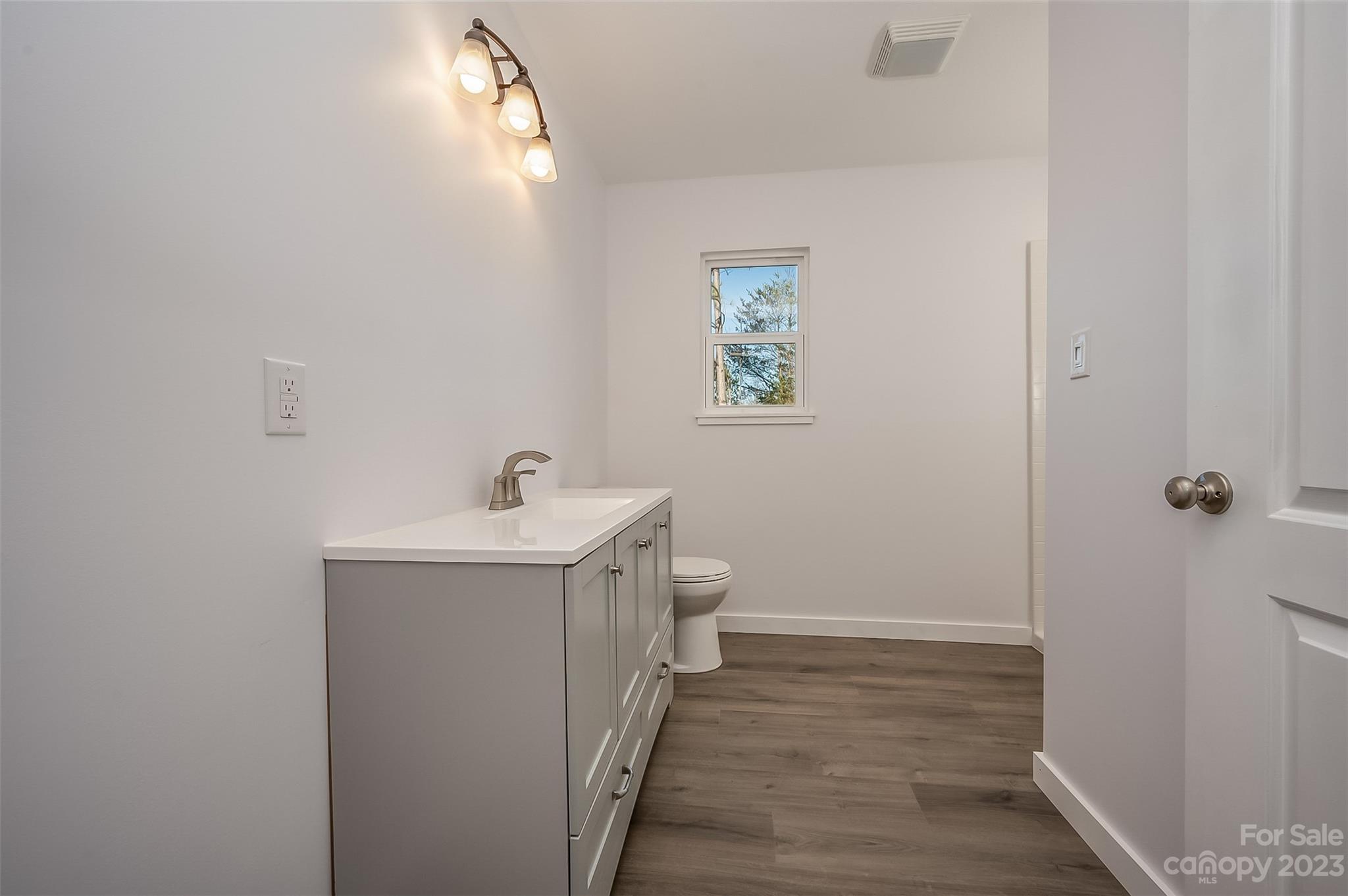 306 Observation Ridge Rutherfordton, NC 28139 - Photo 20 of 36 a bathroom with a sink mirror and vanity