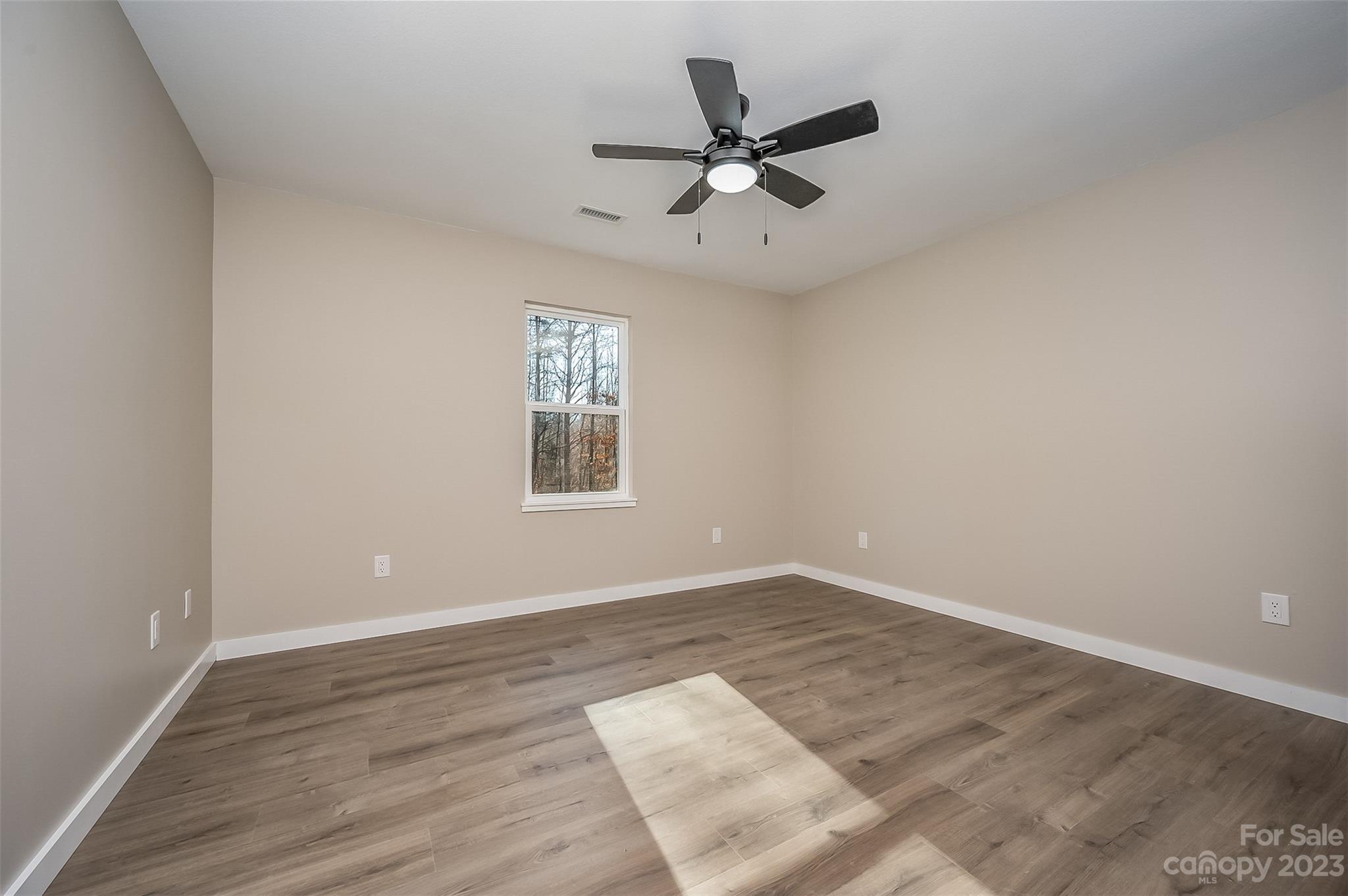 306 Observation Ridge Rutherfordton, NC 28139 - Photo 22 of 36 wooden floor in an empty room with a window