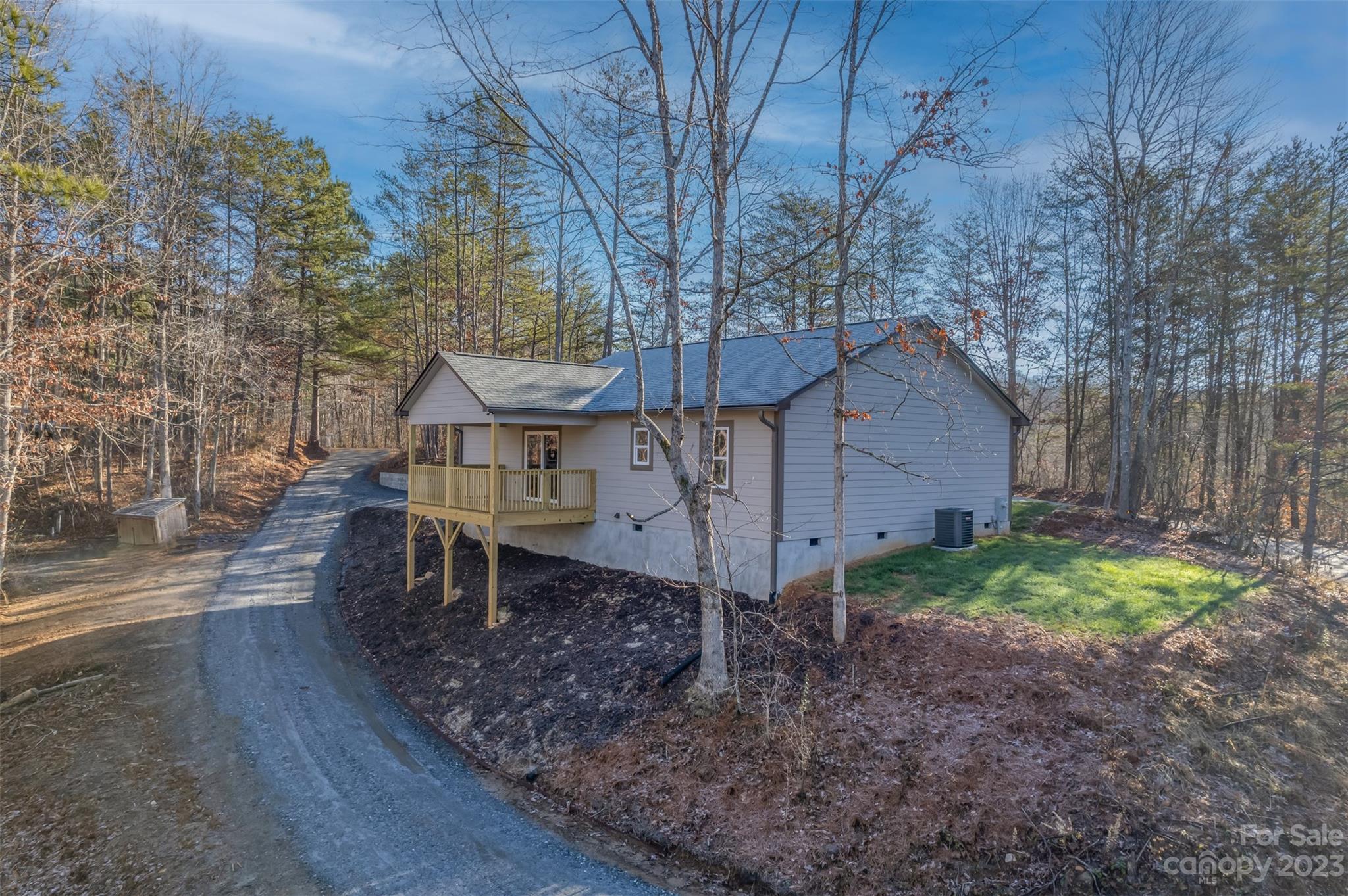 306 Observation Ridge Rutherfordton, NC 28139 - Photo 4 of 36 a house is sitting in middle of the forest