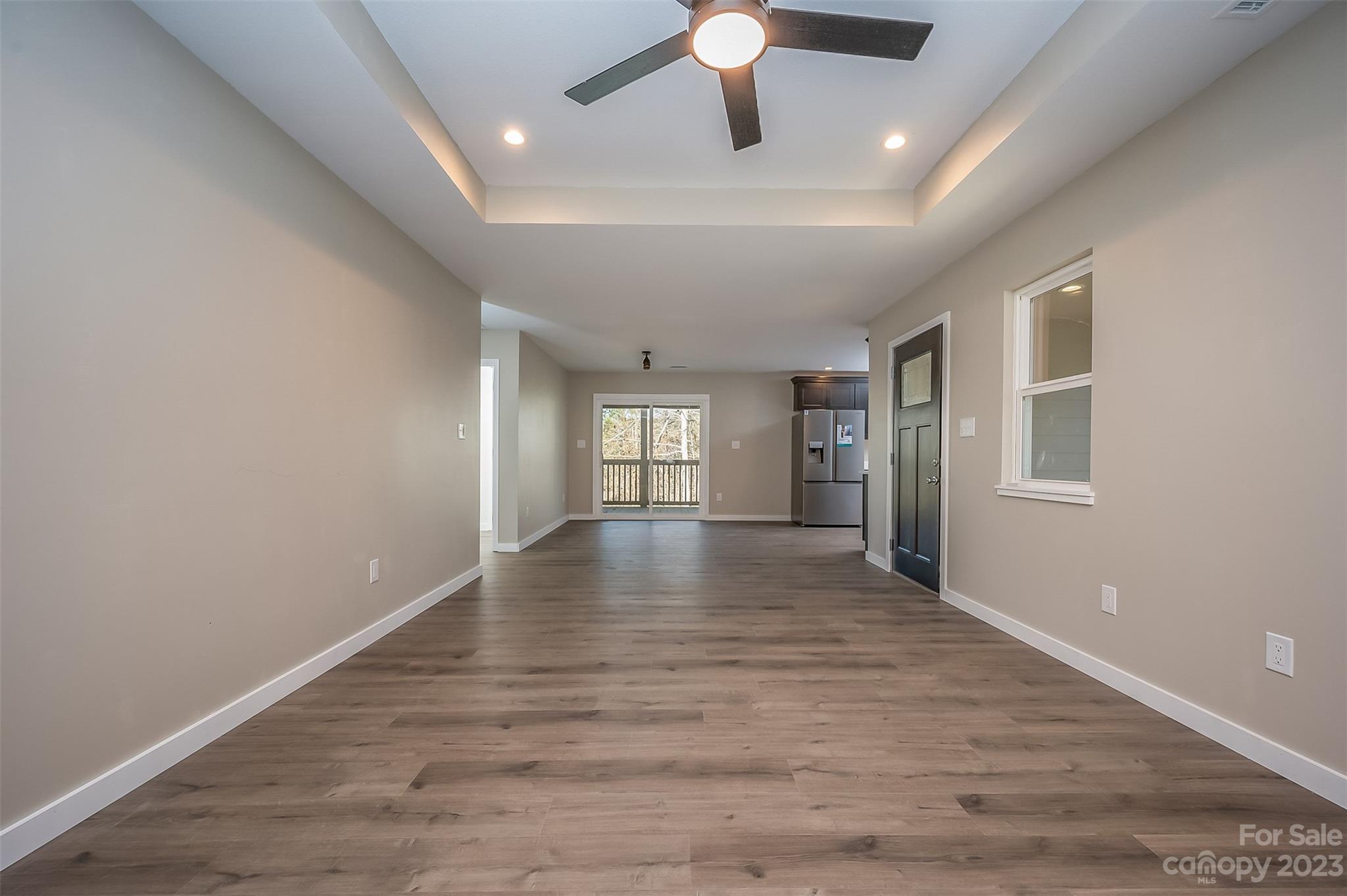 306 Observation Ridge Rutherfordton, NC 28139 - Photo 8 of 36 an empty room with wooden floor and windows