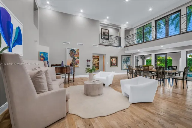 a large kitchen with stainless steel appliances granite countertop lots of counter space and wooden floor