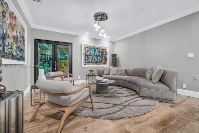 a living room with furniture and a large window