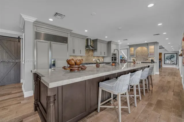 a view of a patio with a dining table and chairs