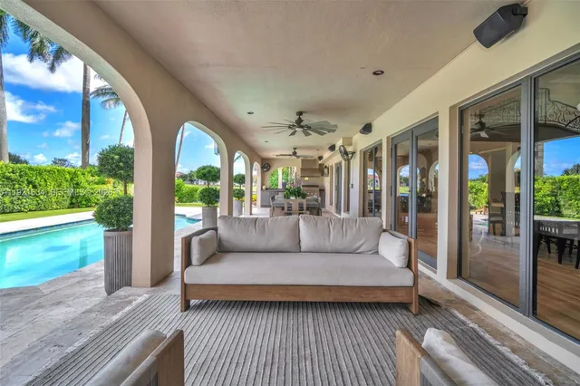 a front view of a house with a garden and patio