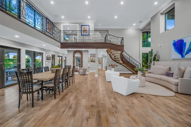 a living room with furniture a rug and a window