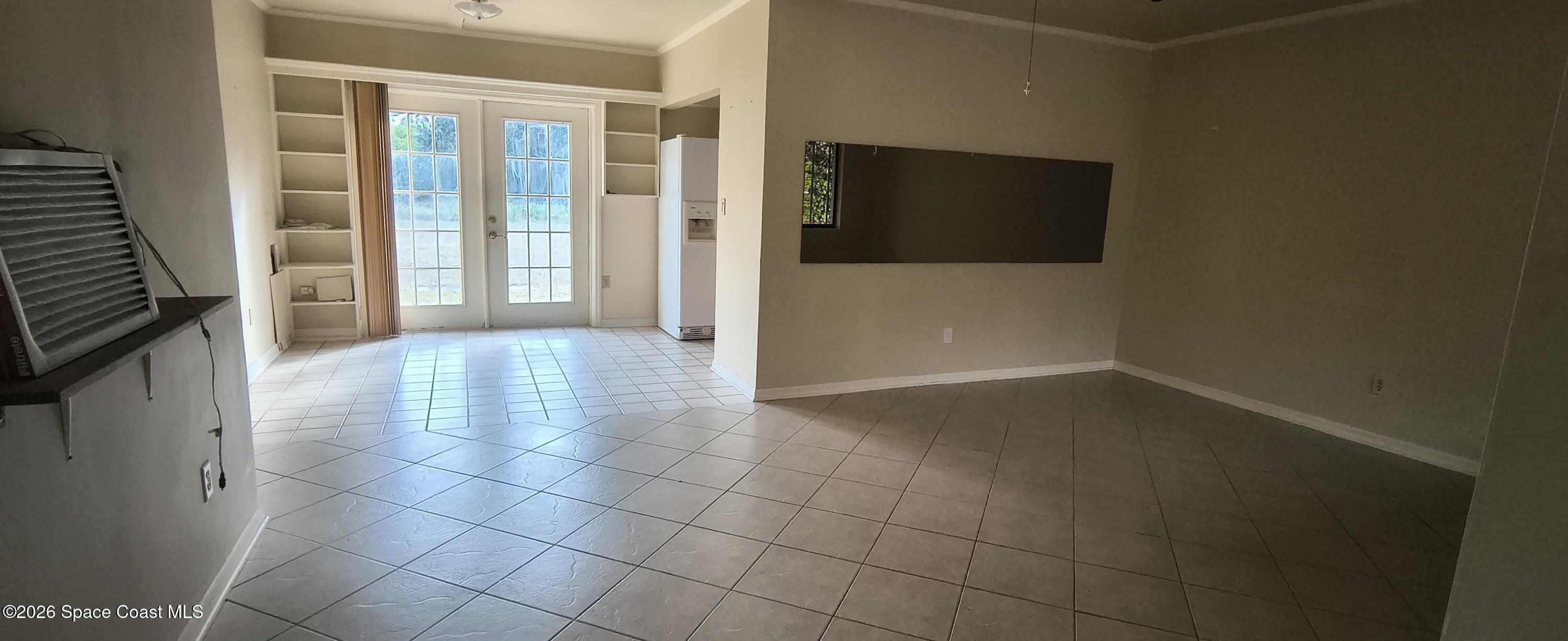 801 Espanola Way Melbourne, FL 32901 - Photo 18 of 18 a view of a livingroom with an empty space and a window
