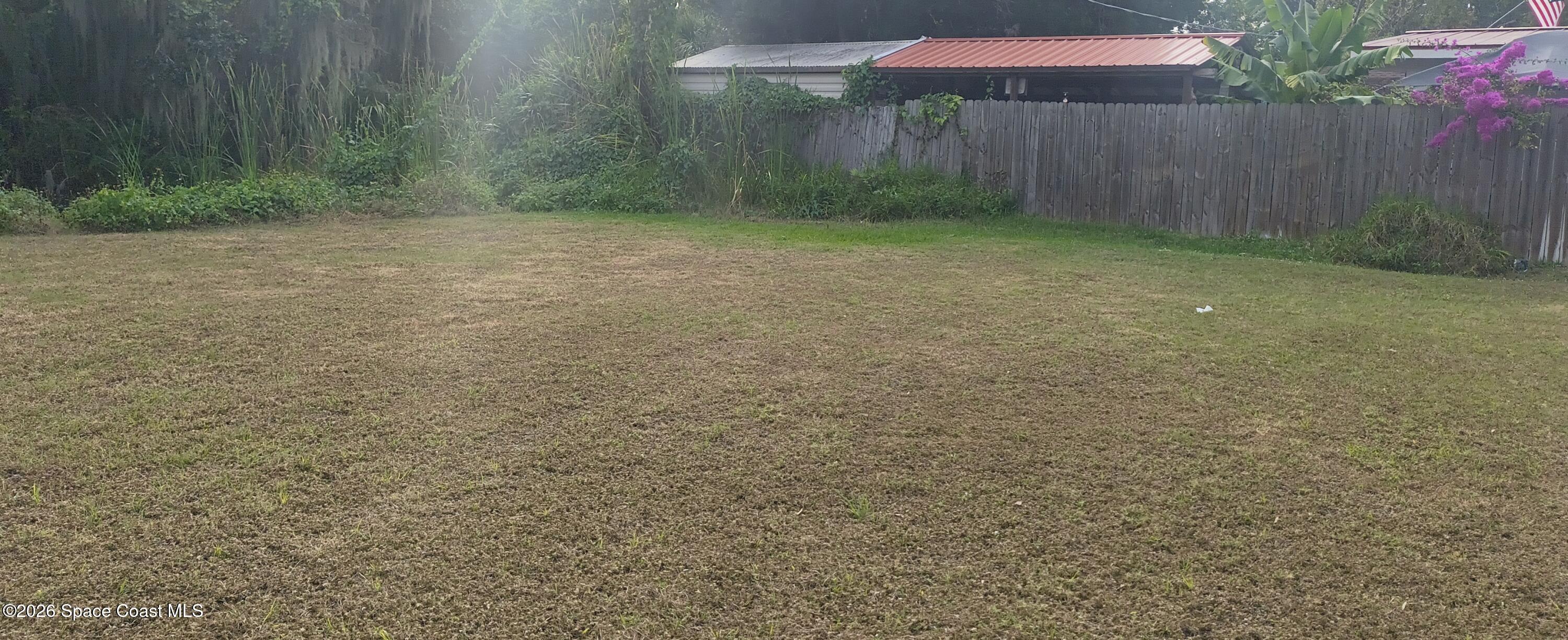 801 Espanola Way Melbourne, FL 32901 - Photo 6 of 18 a view of a yard with an trees
