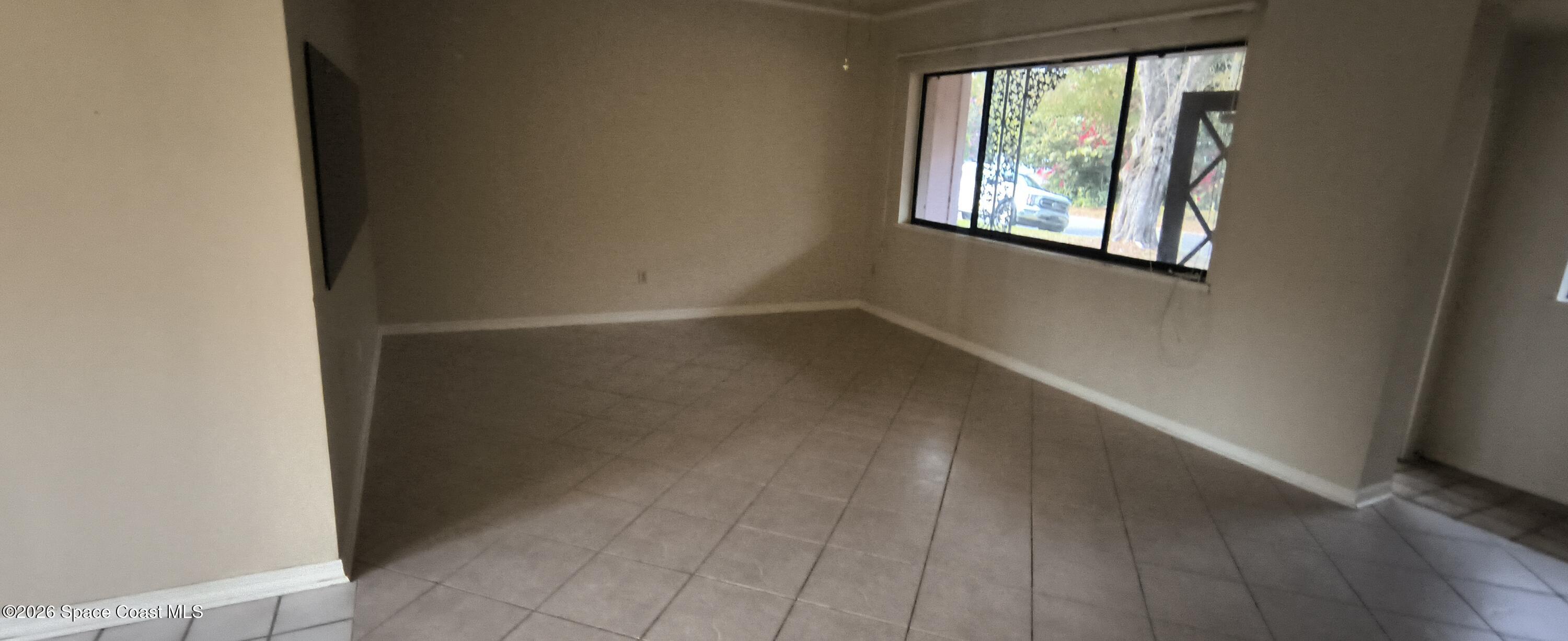 801 Espanola Way Melbourne, FL 32901 - Photo 10 of 18 an empty room with windows