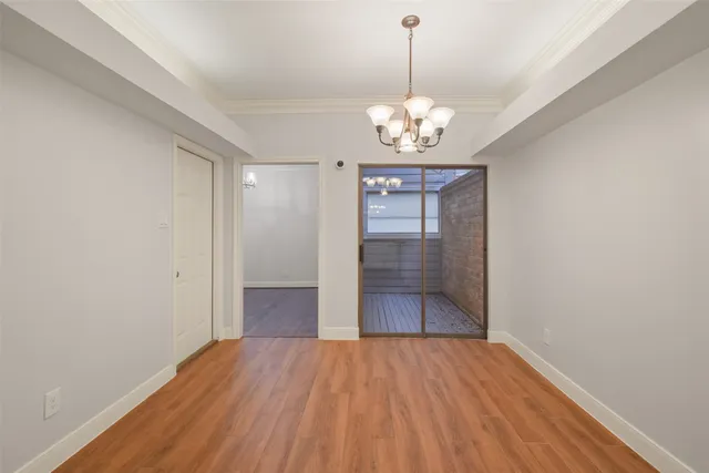 a view of a livingroom with wooden floor