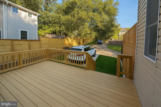 a view of a balcony with wooden floor