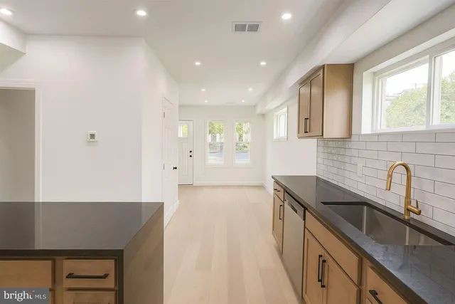 a kitchen with sink and window