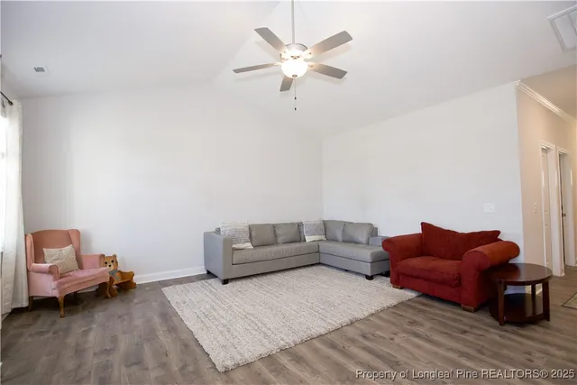 a bedroom with a bed and a television