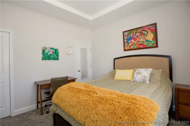 a bedroom with furniture and a window