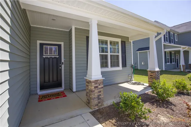 a room with a bench and a wooden door