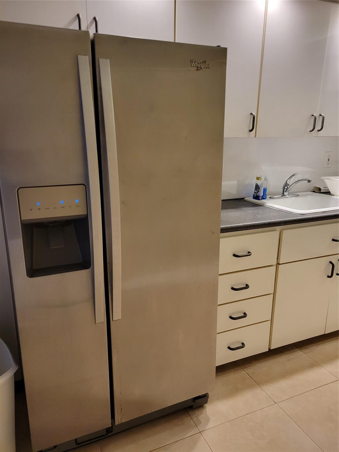 2851 South Ocean Boulevard, Unit 6D Boca Raton, FL 33432 - Photo 13 of 34 a kitchen with a refrigerator and cabinets