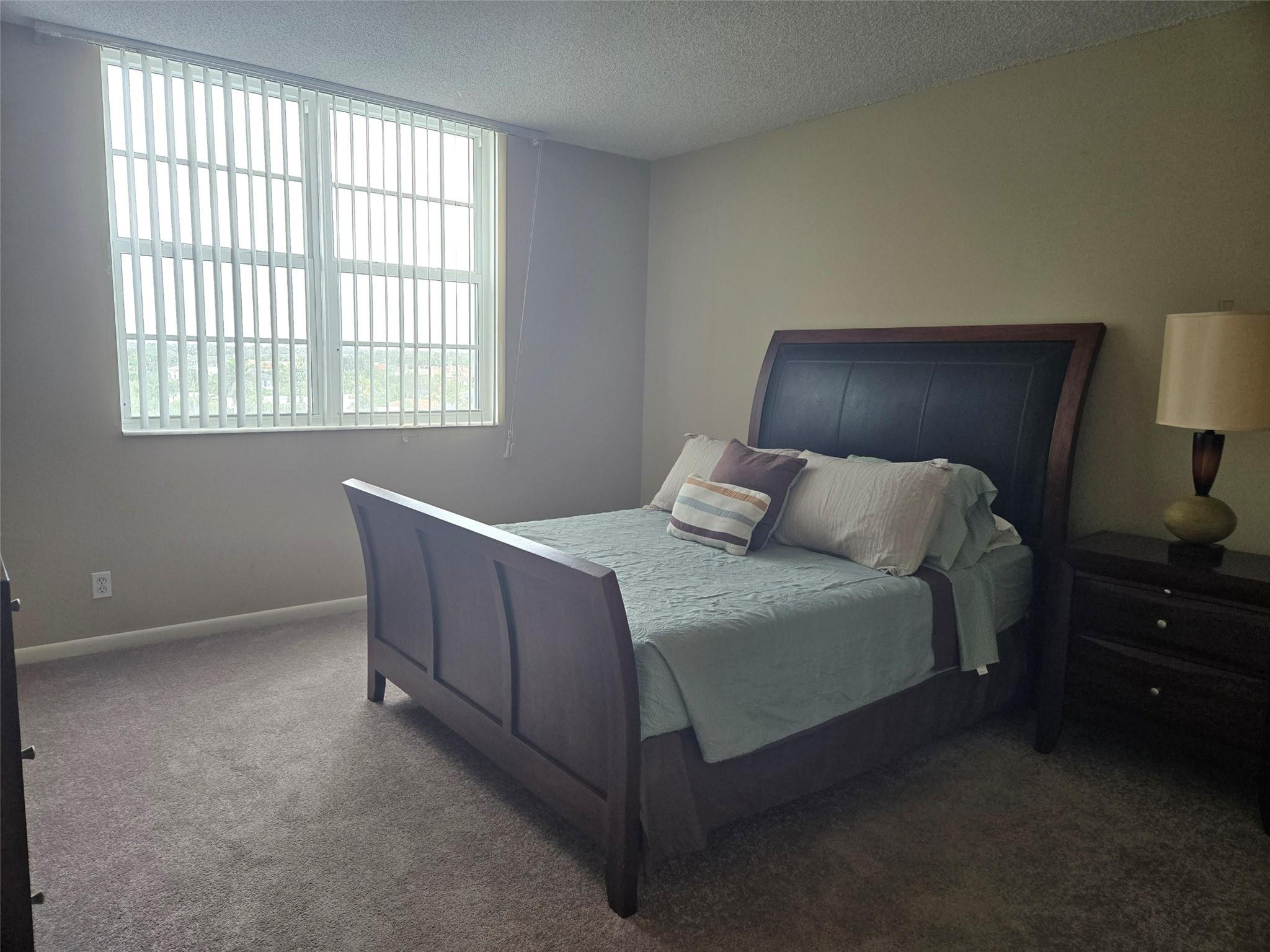 2851 South Ocean Boulevard, Unit 6D Boca Raton, FL 33432 - Photo 15 of 34 a bedroom with bed and window