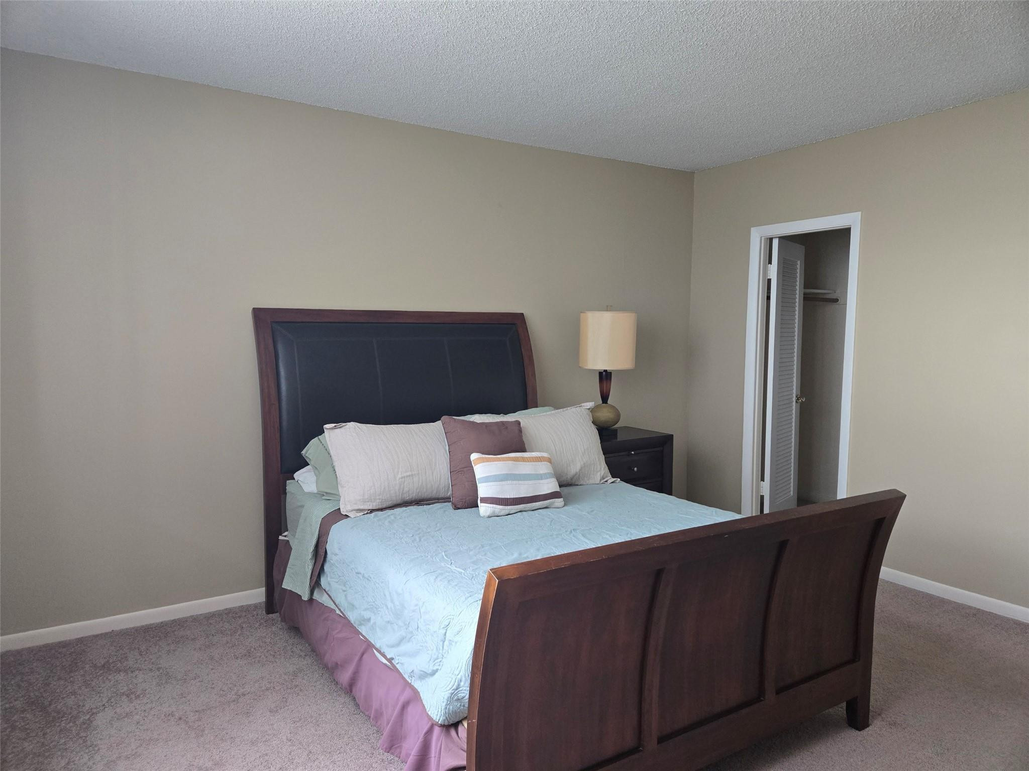 2851 South Ocean Boulevard, Unit 6D Boca Raton, FL 33432 - Photo 16 of 34 a bedroom with a bed and window