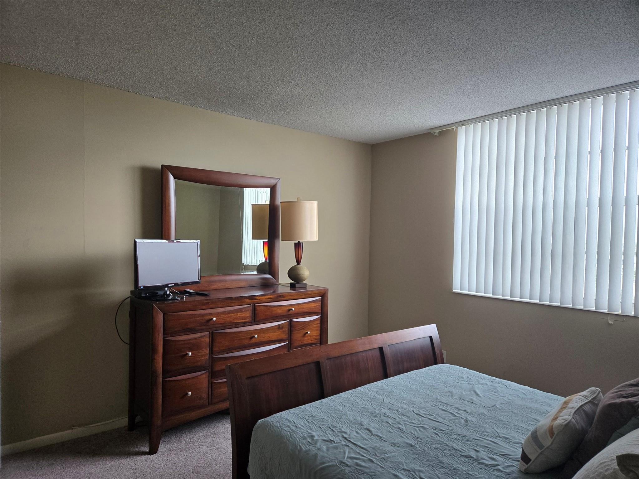 2851 South Ocean Boulevard, Unit 6D Boca Raton, FL 33432 - Photo 18 of 34 a bedroom with a bed and a window