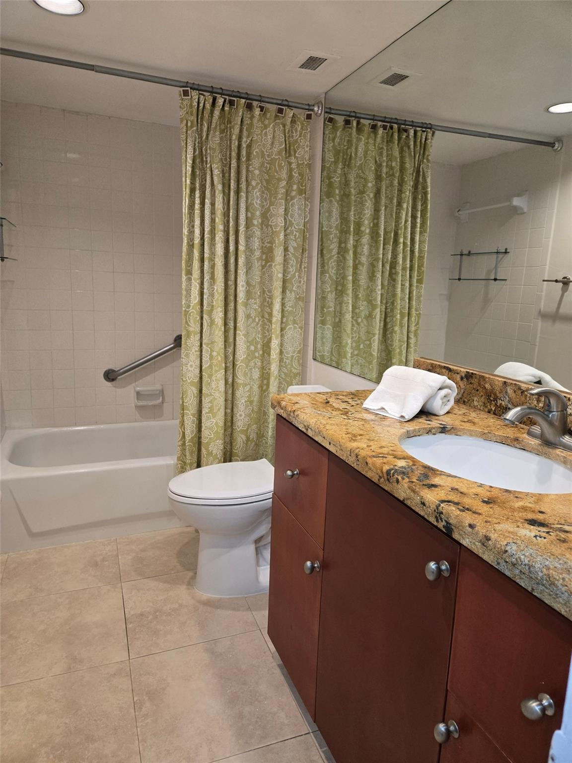 2851 South Ocean Boulevard, Unit 6D Boca Raton, FL 33432 - Photo 20 of 34 a bathroom with a granite countertop bathtub sink vanity mirror and toilet