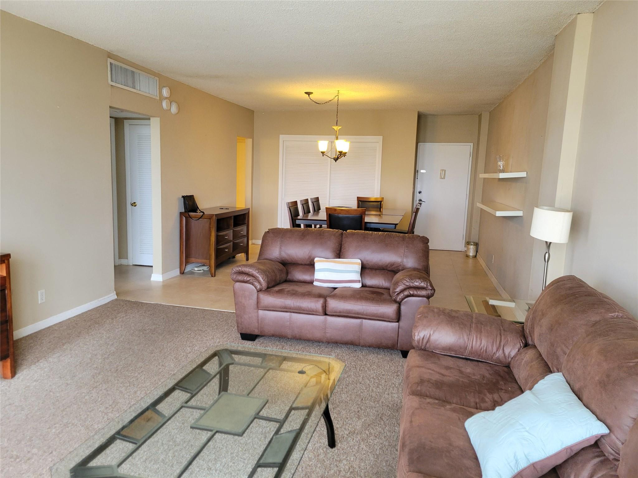 2851 South Ocean Boulevard, Unit 6D Boca Raton, FL 33432 - Photo 2 of 34 a living room with furniture and a couch