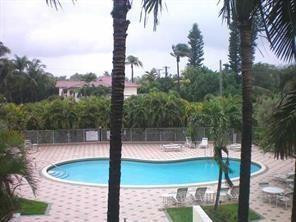 2851 South Ocean Boulevard, Unit 6D Boca Raton, FL 33432 - Photo 29 of 34 a view of a swimming pool with a patio