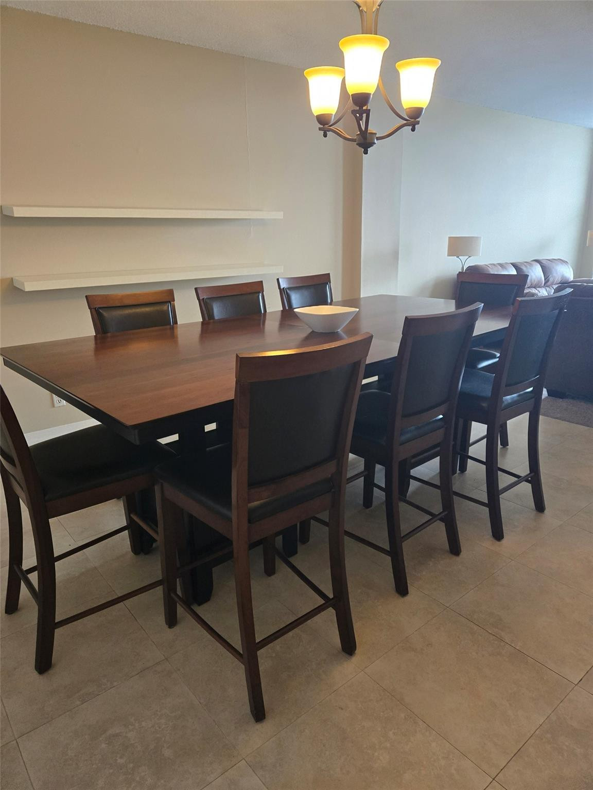 2851 South Ocean Boulevard, Unit 6D Boca Raton, FL 33432 - Photo 30 of 34 a view of a dining room with furniture and chandelier
