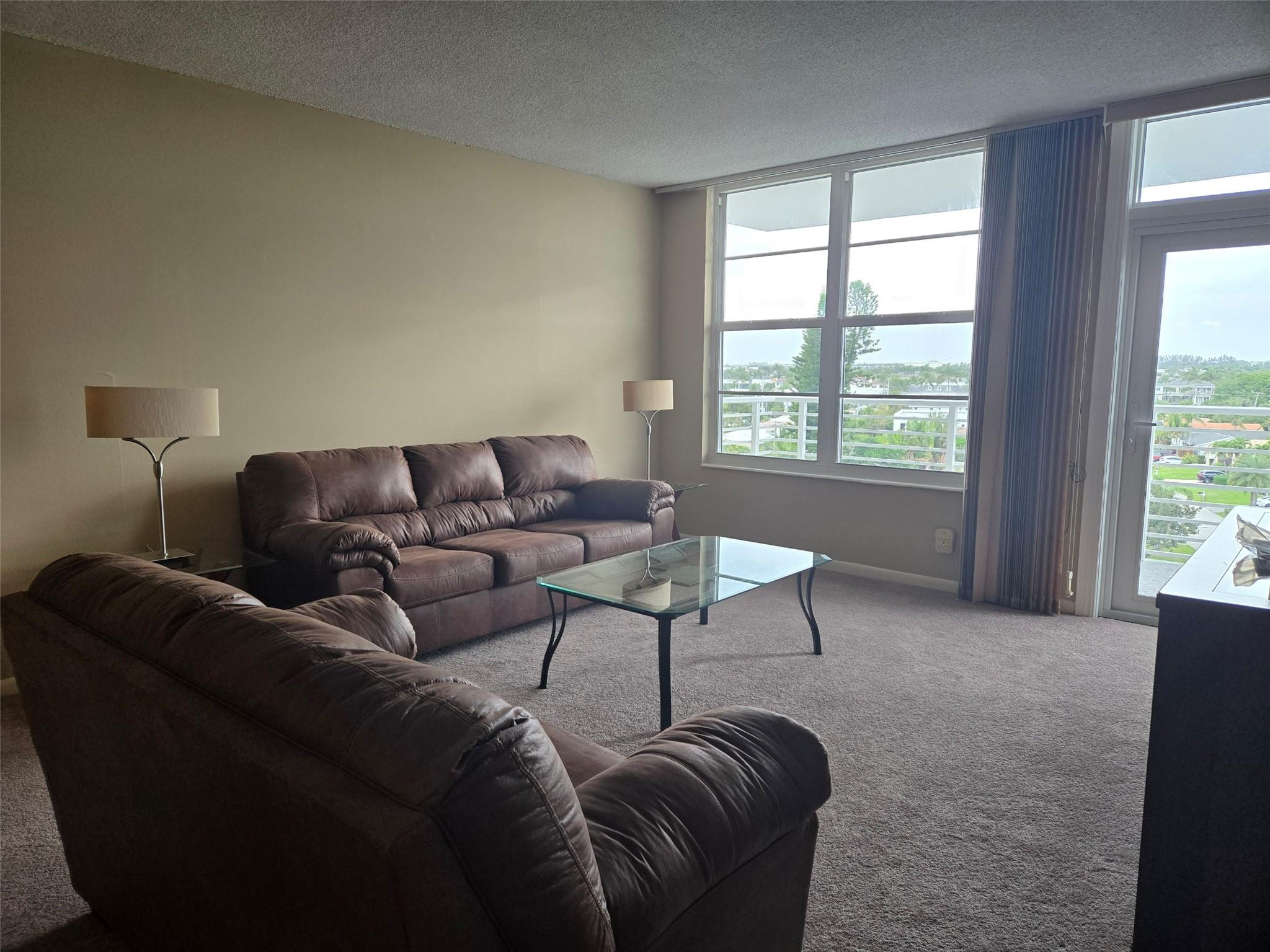 2851 South Ocean Boulevard, Unit 6D Boca Raton, FL 33432 - Photo 4 of 34 a living room with furniture and a window