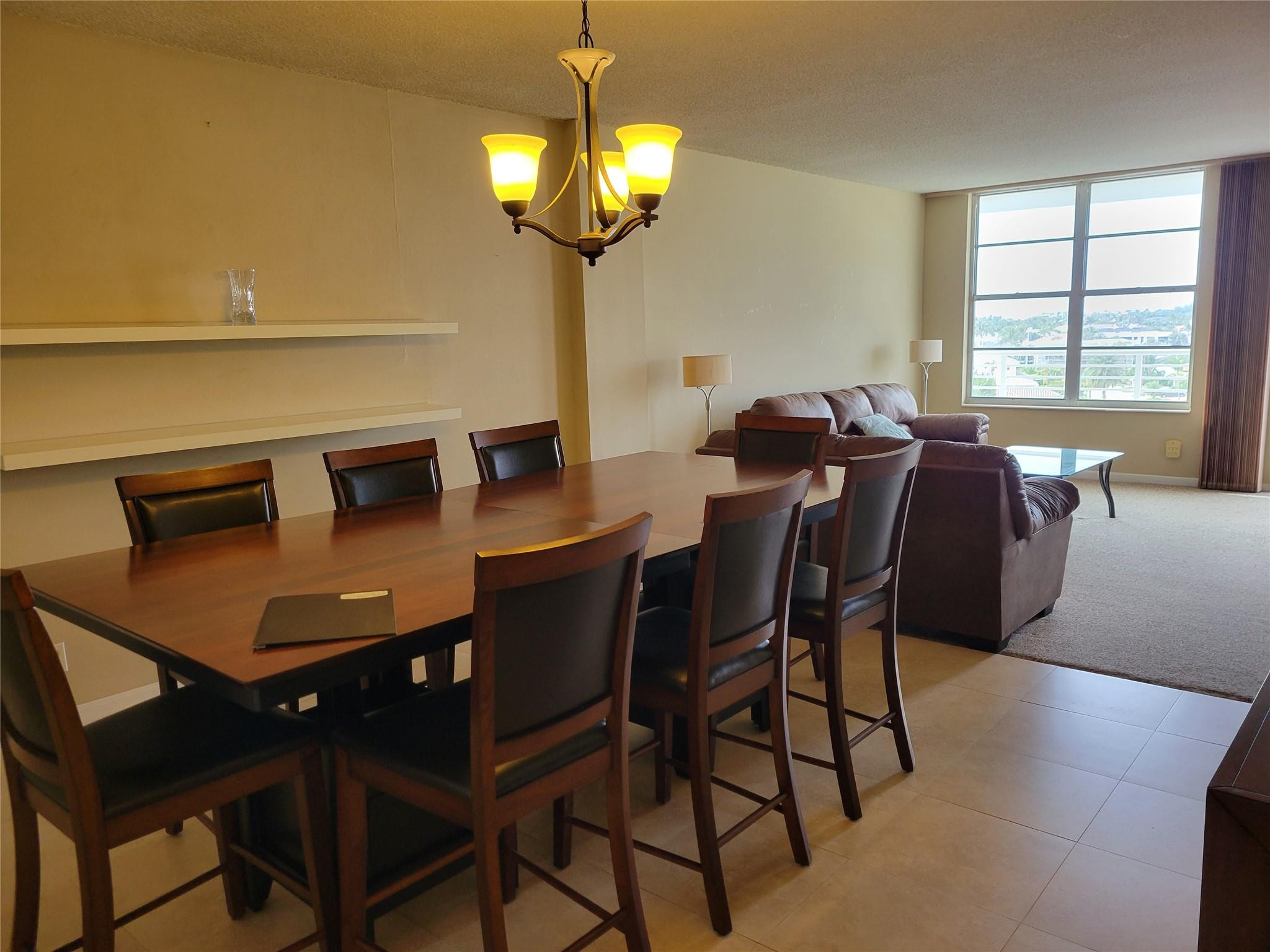 2851 South Ocean Boulevard, Unit 6D Boca Raton, FL 33432 - Photo 8 of 34 a view of a dining room with furniture and chandelier