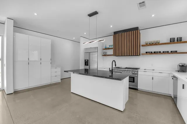 a kitchen with a sink and cabinets