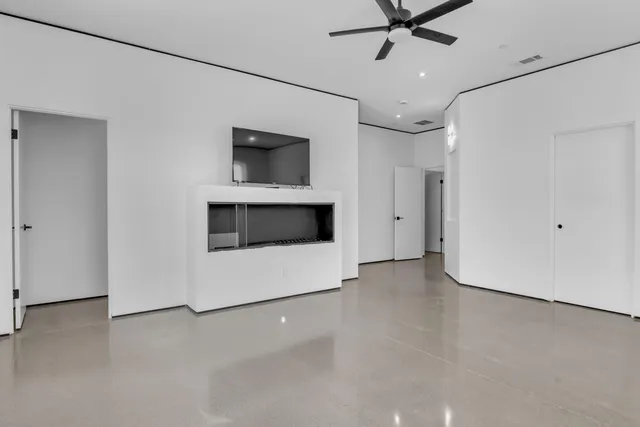 a bathroom with a double vanity sink mirror and shower