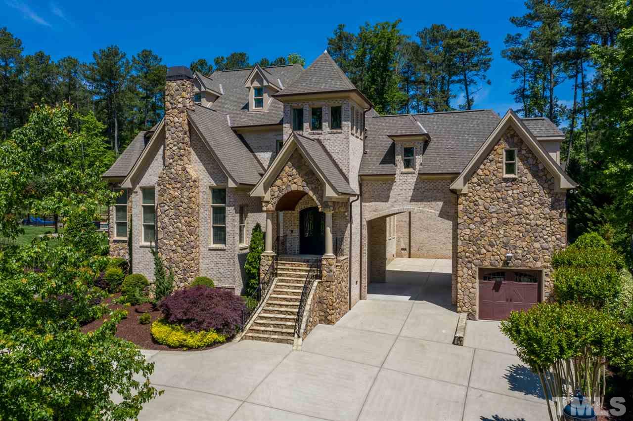 12515 Tuscan Lake Road Raleigh, NC 27613 - Photo 1 of 30 a aerial view of a house with table and chairs and potted plants