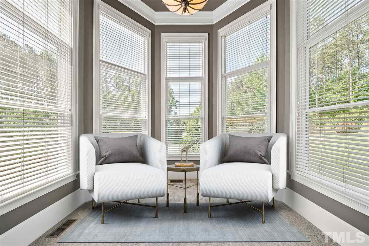 12515 Tuscan Lake Road Raleigh, NC 27613 - Photo 21 of 30 a living room with furniture and a large window